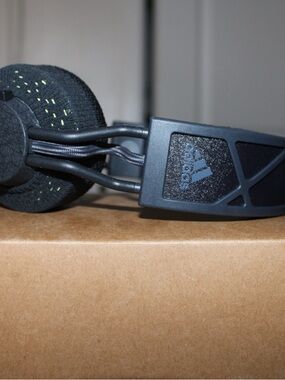 adidas Matte Black On-Ear Headphones with Subtle Green Stitching